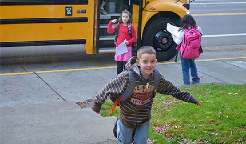 Kids running from bus