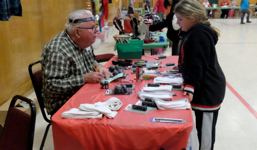 A student shops at the Spirit of Giving event.